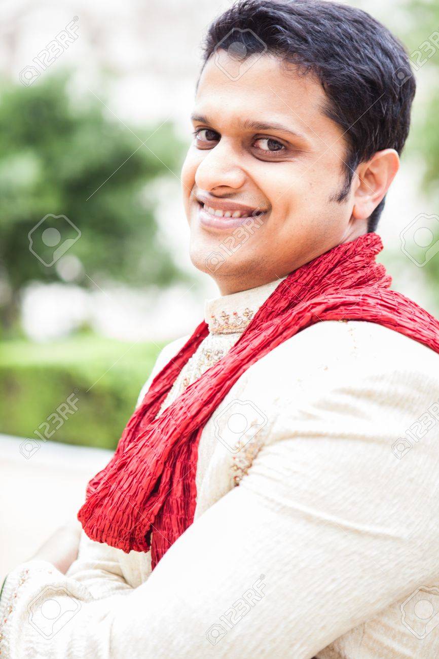 19262801 attractive indian groom in traditional attire at wedding